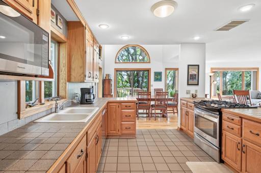 Kitchen leads into the informal dining area.