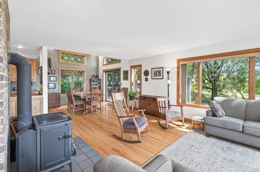 View of the informal dining from the living room. Beautiful views of the property in every direction of the home.
