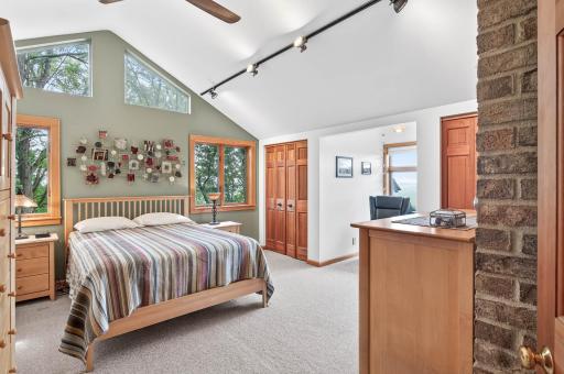 Upper level large primary bedroom has tons of natural light, private bath and his and her closets.