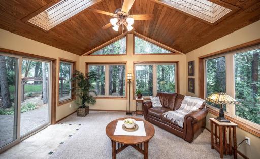 Welcome to this home featuring this spectacular sunroom! Surrounded by windows, extra-wide sliding doors and skylights to let all of the light in plus beautiful views of the backyard.