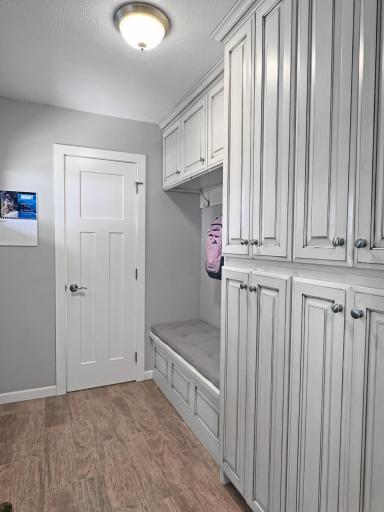 Entry area with built in storage and a bench