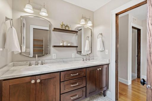Updated Upper Level Bathroom with double sinks and custom cabinetry