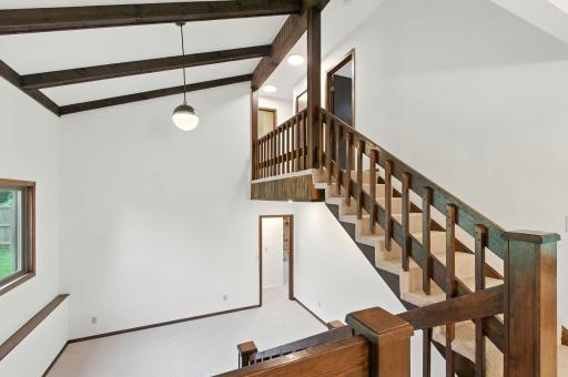Main level - standing in dining room looking up to bedrooms and down to family room
