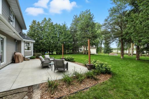 Lovely rear exterior patio space overlooking Rice Lake