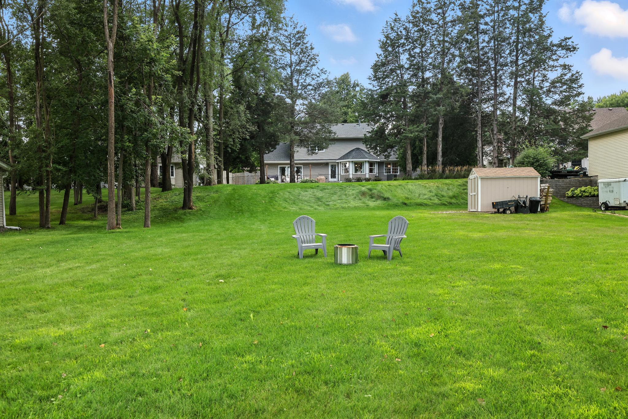 Rear exterior of the home looking up from the lake