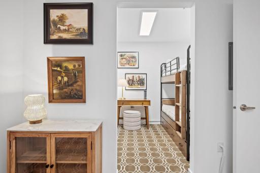 The bump out room off of the office/den is large enough for a set of bunk beds and some furniture for guests.