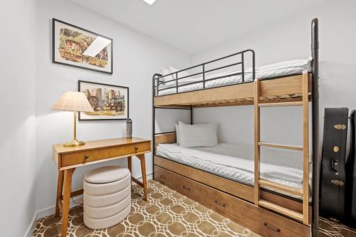 The bump out room off of the office/den is large enough for a set of bunk beds and some furniture for guests.