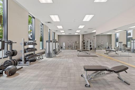 In addition to this weight room there is also a gym on the 2nd level with bikes, treadmills, yoga space and more.