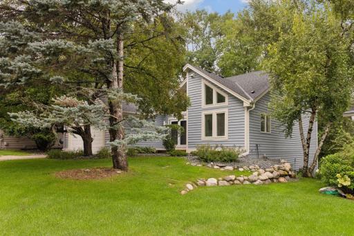 One-level living, low maintenance! Private, treed lot with nature views!