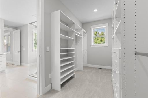 Primary bathroom features a spa-inspired ensuite bath with soaking tub, walk-in shower, and spacious walk-in closet