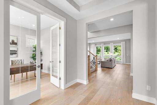 An inviting office near the front entrance, complete with stylish double doors.