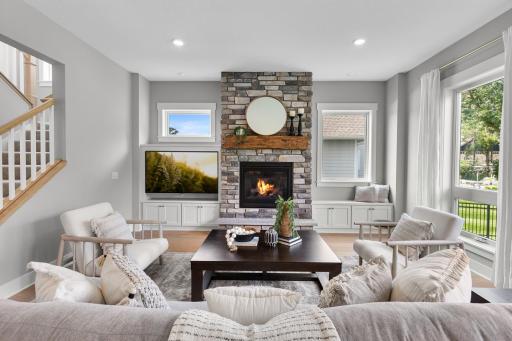 The living room features elegant finishes and a warm, welcoming atmosphere