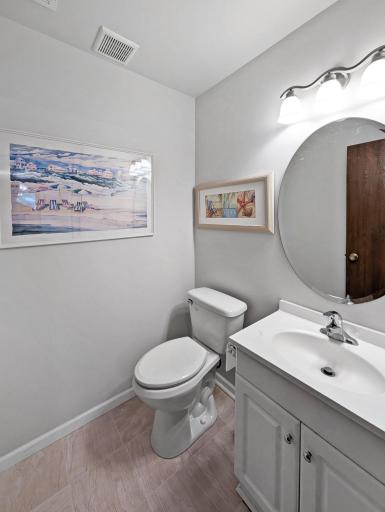 Main floor half bath features some art and fresh paint!