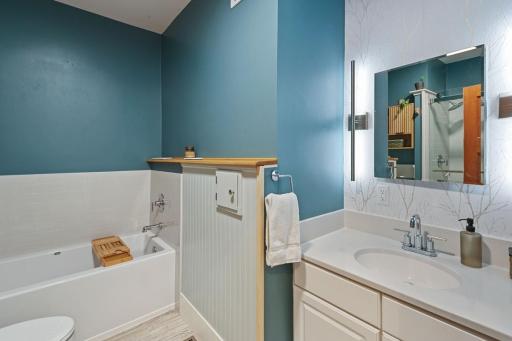 Stylish main floor bathroom fully updated in 2025 with new plumbing and a modern remodel.