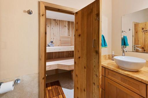Lower-level features a sauna with shower. A relaxing retreat designed for comfort and convenience right at home.
