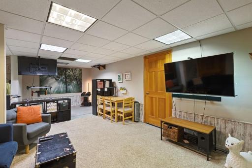 Enjoy the cozy lower-level family room with a gas fireplace or take advantage of the sauna and exercise area.