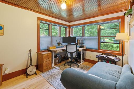 Sun-filled flex room with large windows and a beautiful wood-paneled ceiling. Perfect as a home office, sunroom, or creative space, offering both charm and functionality.