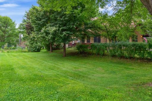 Second parcel offering a spacious, tree-lined yardâan ideal setting for gardening, outdoor games, or simply enjoying extra green space.