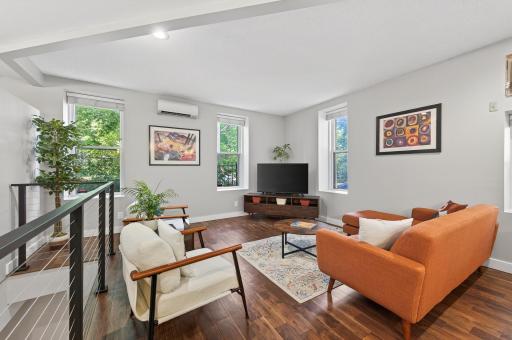 Bright main living area with large windows and a modern open layout