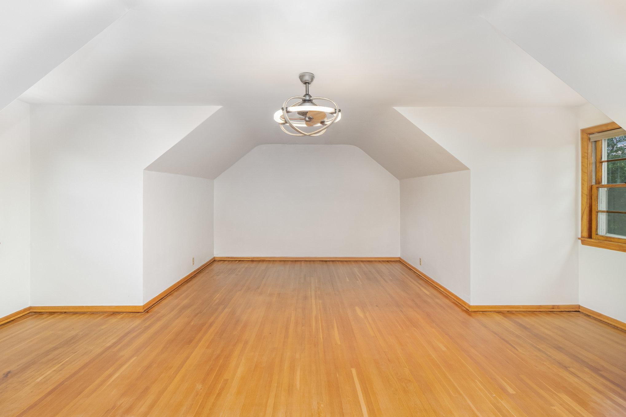 This spacious bedroom is on the upper level.