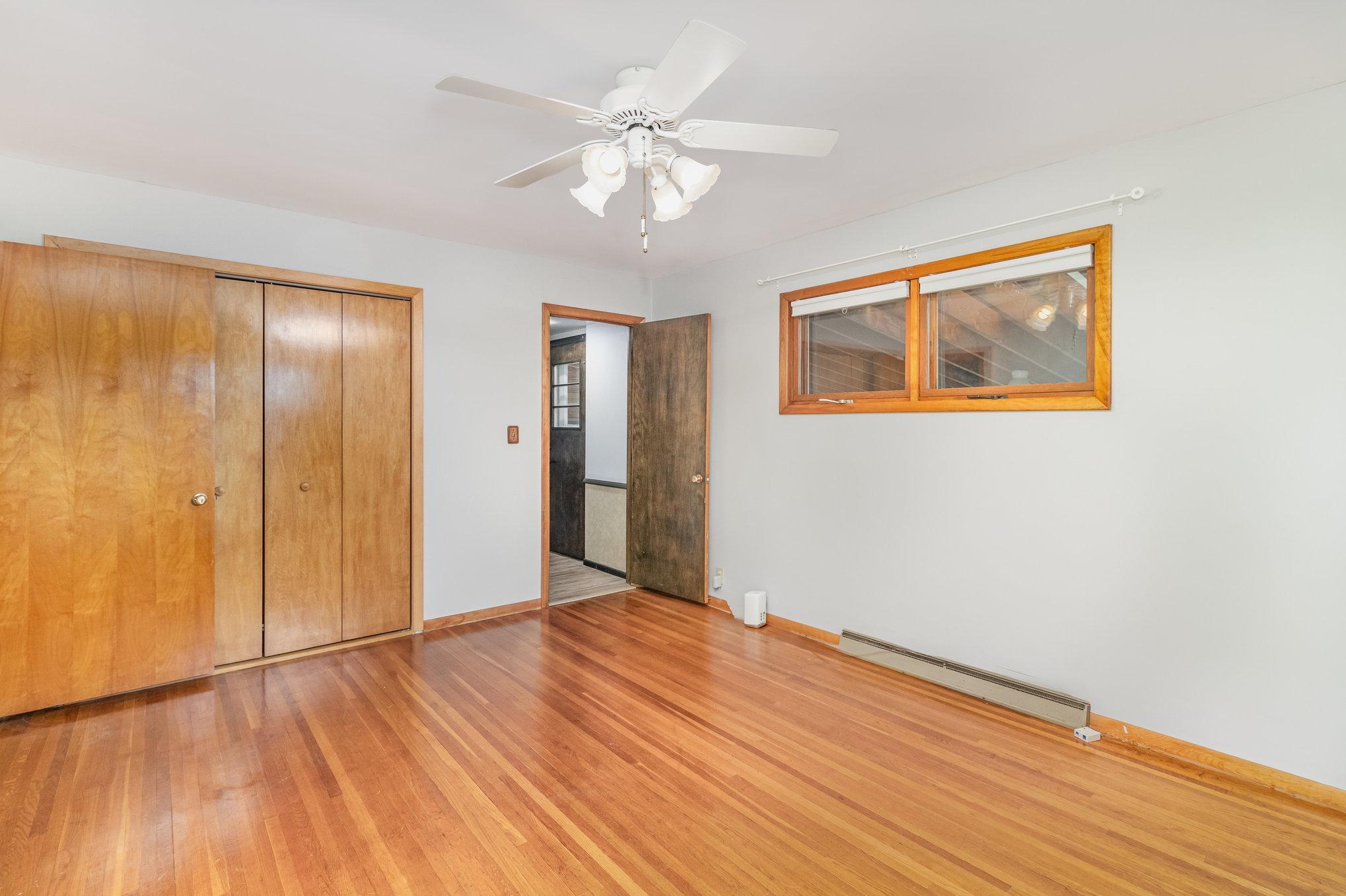 This bedroom has access to kitchen/porch area as well as hallway to bathroom.