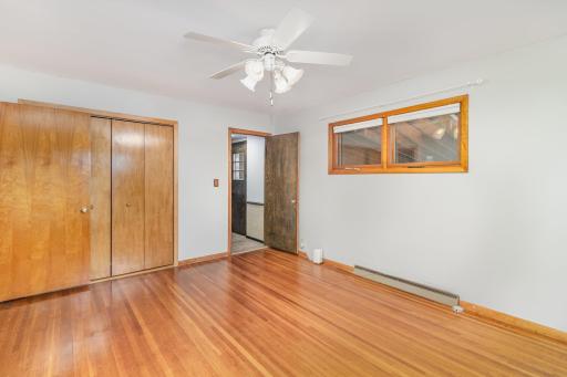 This bedroom has access to kitchen/porch area as well as hallway to bathroom.