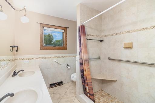 Freshly painted main floor bath features ceramic tile walk-in shower!
