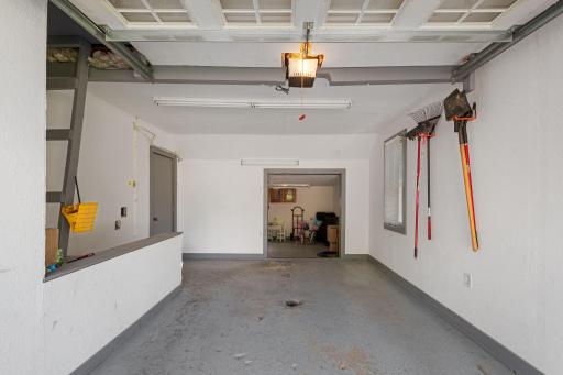 Oversized 1-car garage leading to the workshop