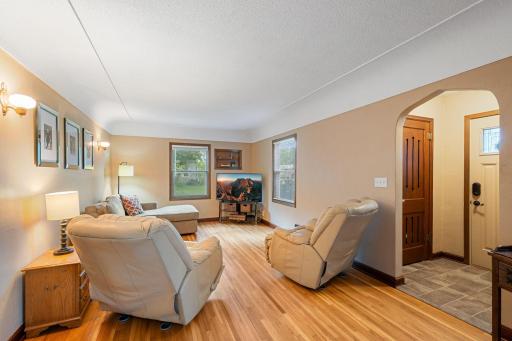 Roomy living room showing off the original hardwood floors!