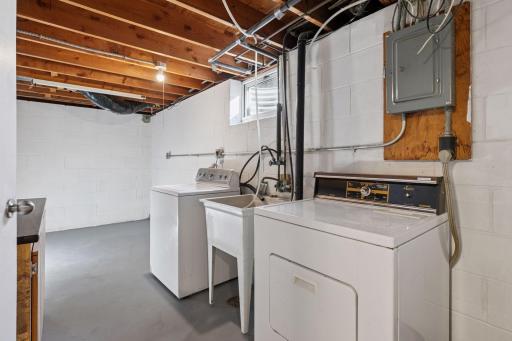 With three separate storage rooms equipped with built-in shelving, organization is effortless. The lower level also houses the utility area with washer and dryer, and hot water hook-up to exterior faucet in backyard.