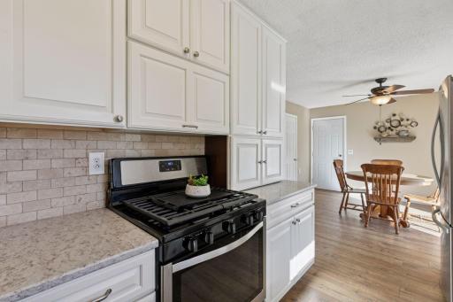 Soft-close drawers and an attractive tiled backsplash.