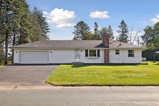 Welcome to 14620 Delft Ave. Neutral vinyl white siding, gutterguard gutter system, newer driveway.