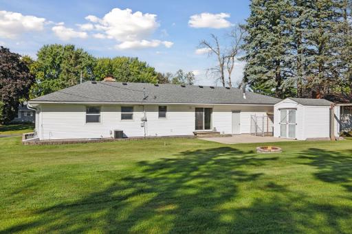 A firepit for evenings under the stars, and a fenced dog kennel that makes the home especially pet-friendly.