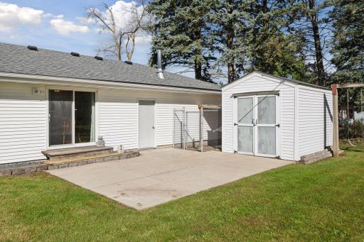 Outside, the property continues to impress. A large backyard patio extends the living space outdoors, providing plenty of room for dining, lounging, or hosting gatherings.