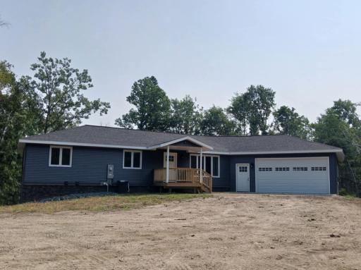 Stunning 2-story walkout sits on 5 heavily wooded acres, only one block from the Mississippi River and dam—perfect for tubing, kayaking, and year-round outdoor fun.