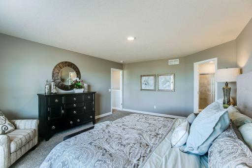 Luxury bedroom suite. *Photos of a similar home. Colors and options will vary.