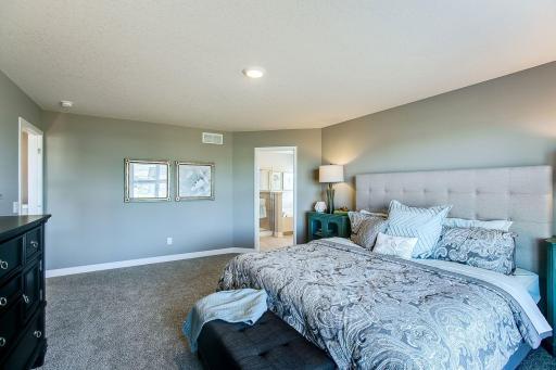 Luxury bedroom suite. *Photos of a similar home. Colors and options will vary.