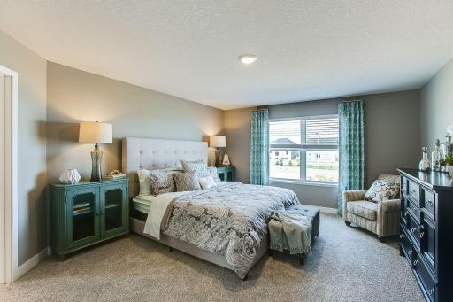 Luxury bedroom suite. *Photos of a similar home. Colors and options will vary.