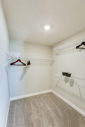 Double large closets in the primary suite. *Photos of a similar home. Colors and options will vary.