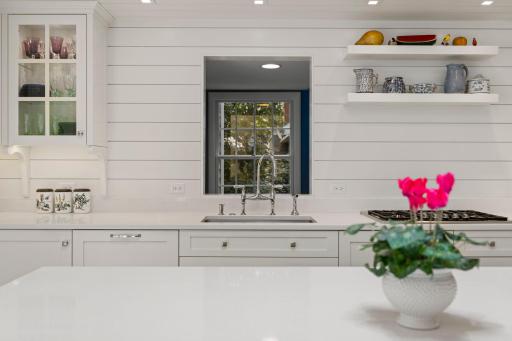 The view from the kitchen to the main level laundry beyond