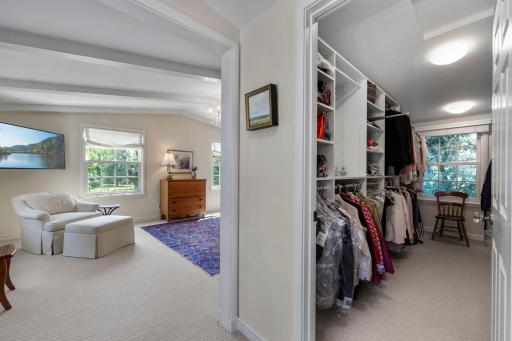 View to primary suite sleeping area and walk-in closet