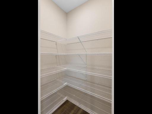 Kitchen Walk In Pantry. Photo taken of another home with similar plan and finishes. Photos and renderings may not depict actual plan, materials, & finishes may vary. All measurements are approximate.