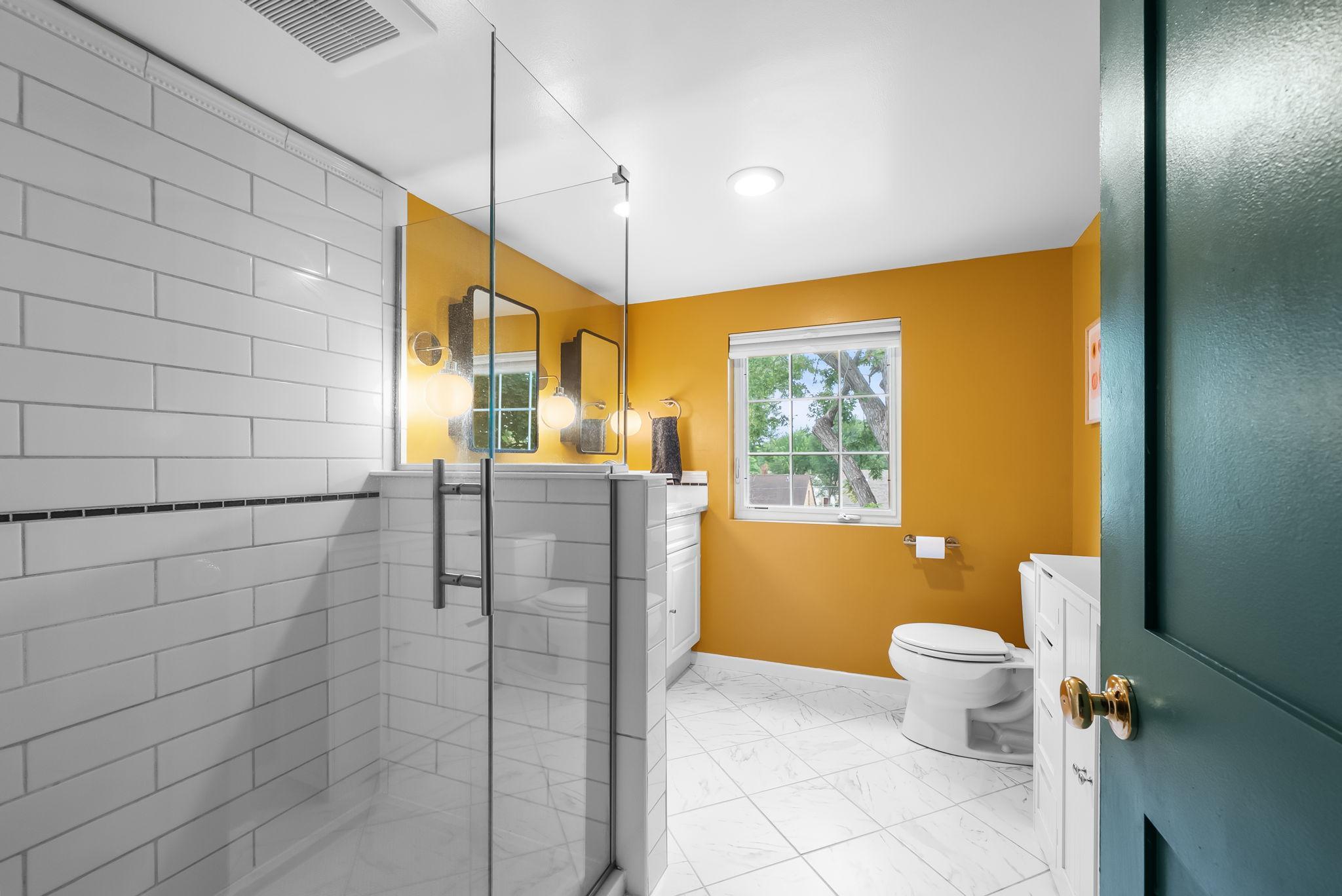 Primary ensuite includes a walk in shower and ample storage space.