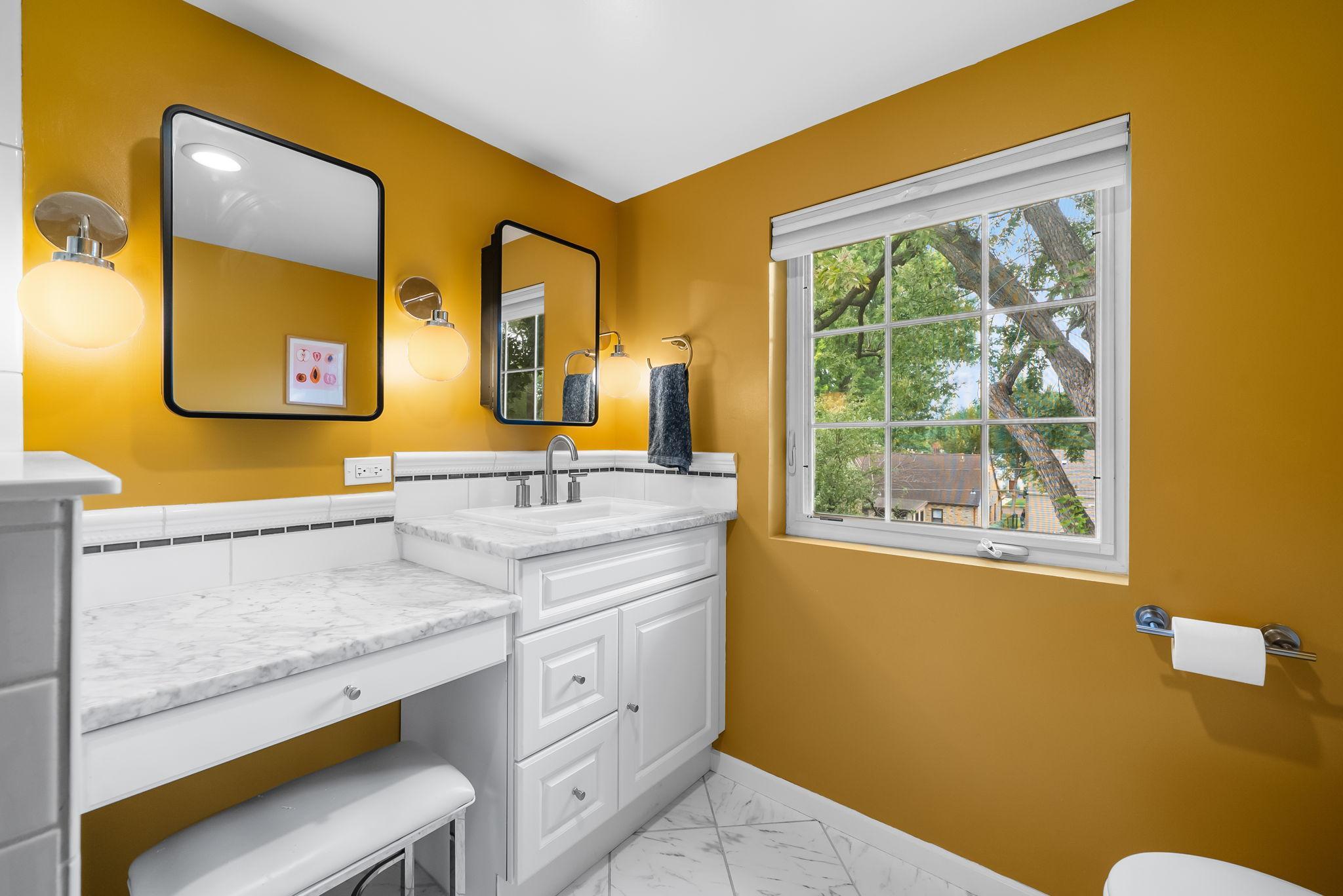 Built in vanity with an abundance of natural light.
