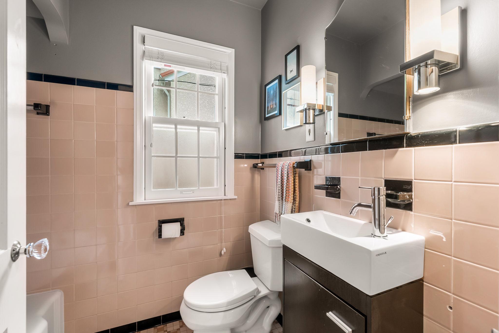 The main floor full bathroom is full of dreamy vintage tile.