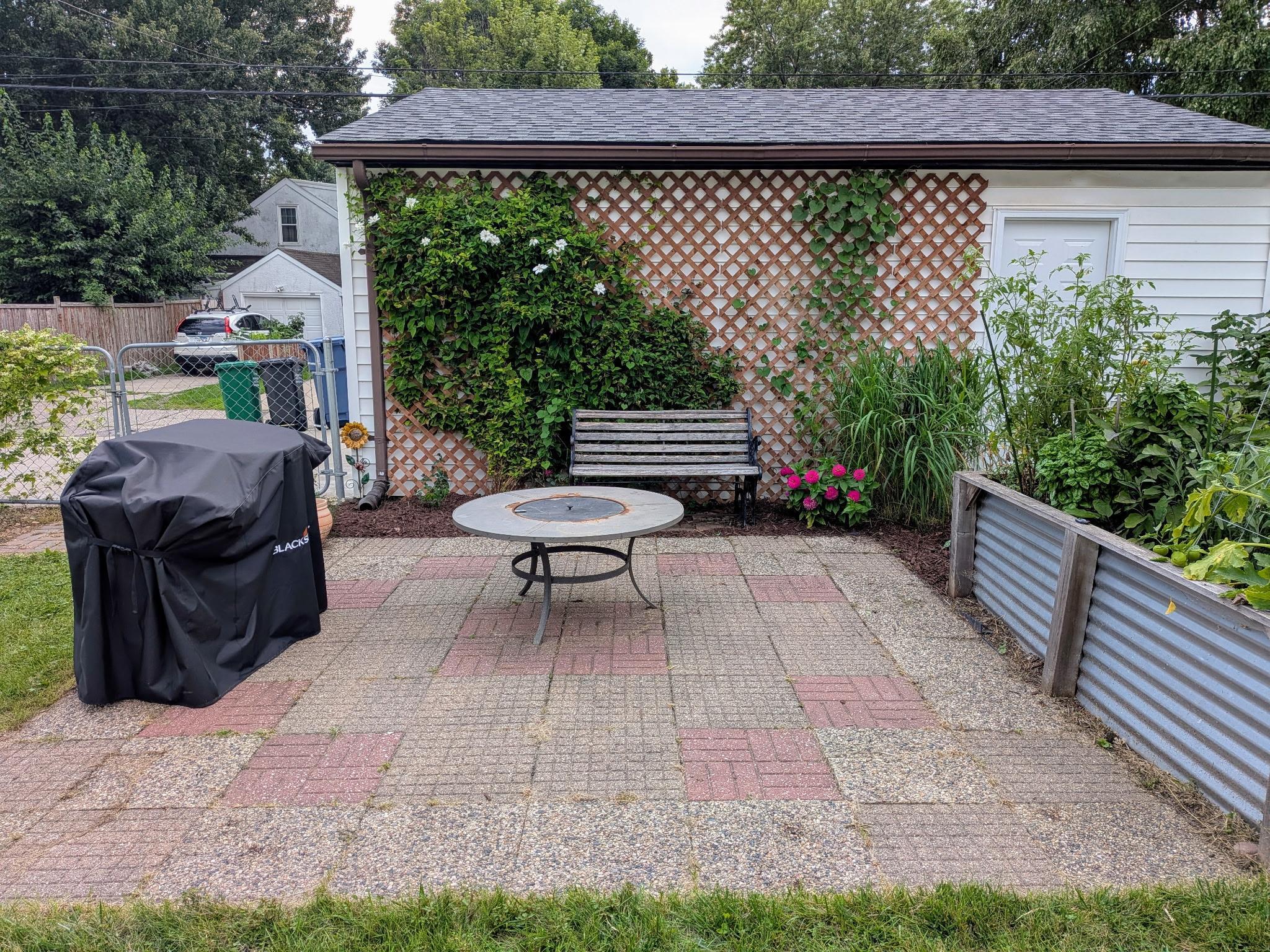 Great patio for grilling and entertaining. Check out the huge raised garden bed just to the right.