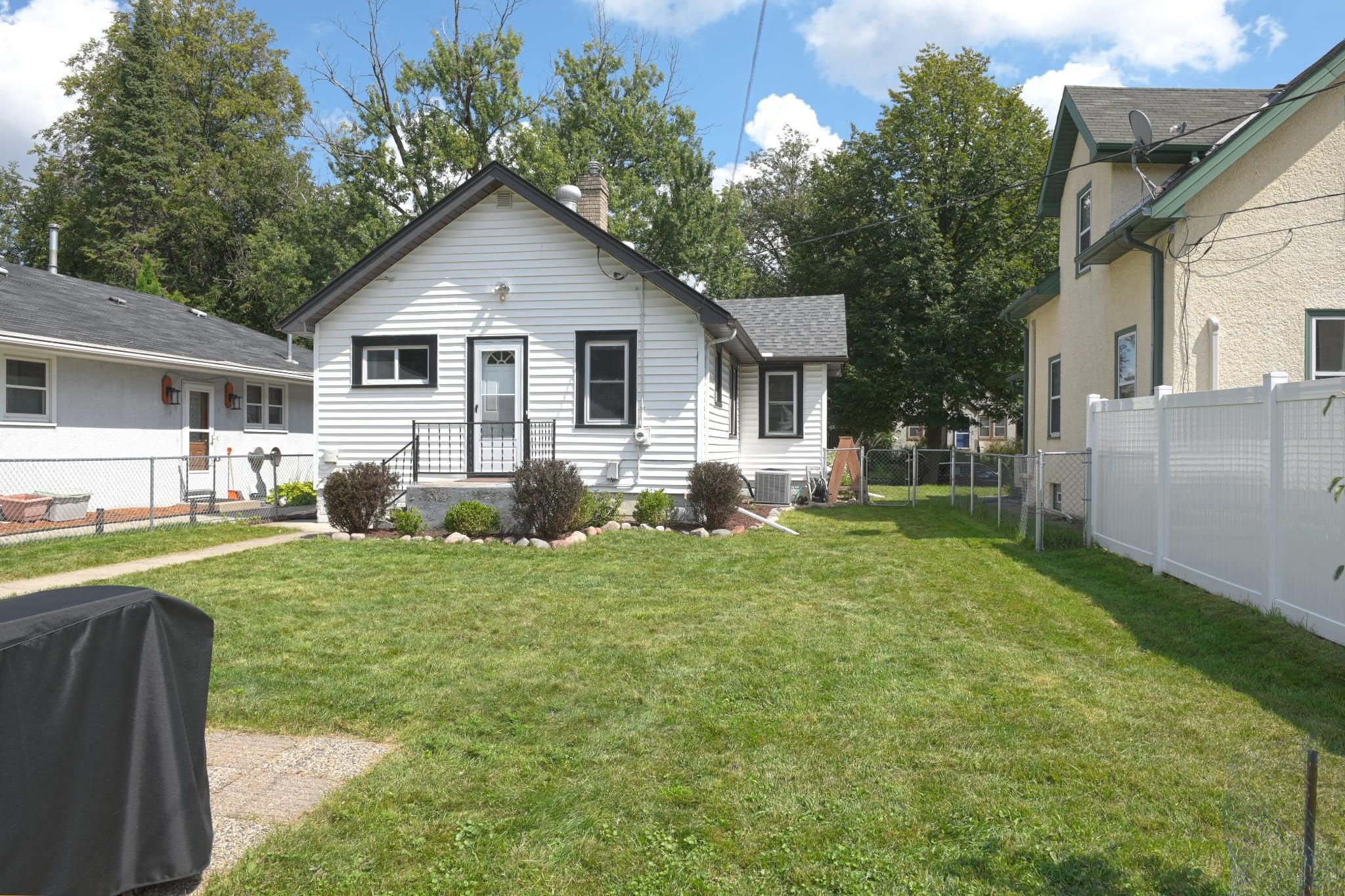View of the back of the house. Yard is completely fenced and even has wide gate on the back for possible boat storage.