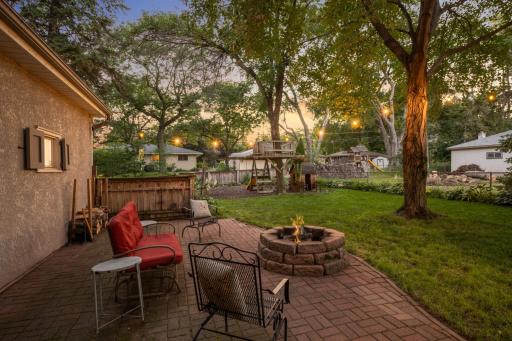 Walk out the back door to a beautiful patio and fenced yard