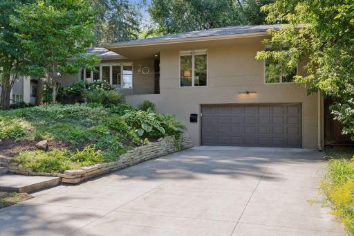 Located on a dead end street...this home boasts a two-car garage offering convenience and functionality, blending seamlessly with the home’s thoughtful design.