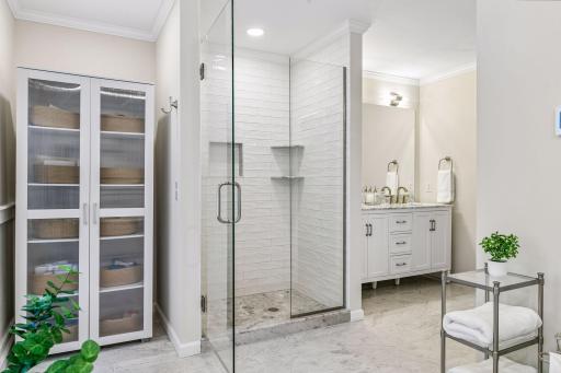 Primary bathroom with large, tiled walk-in shower